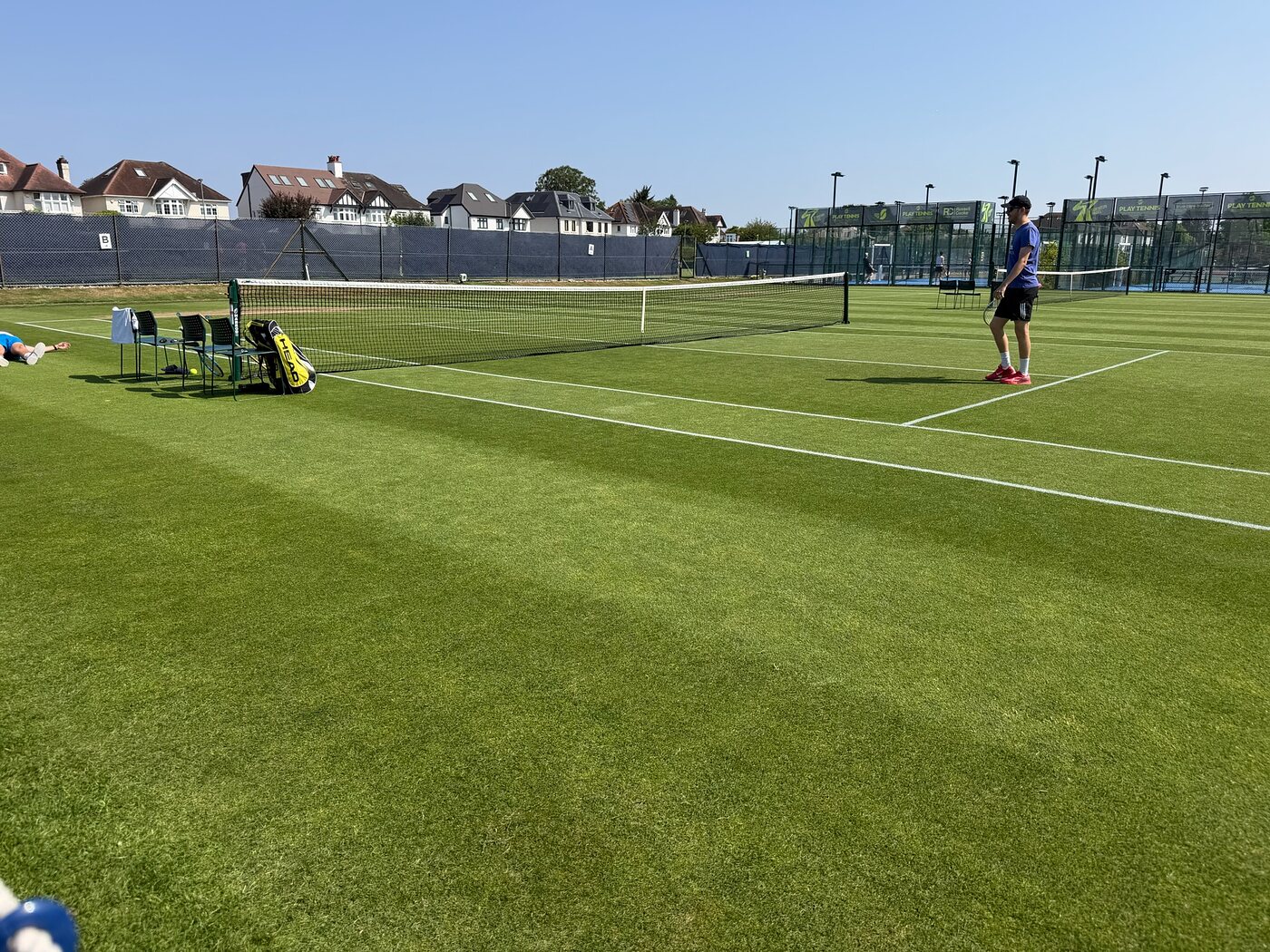 The same grass courts lush and in play the following summer